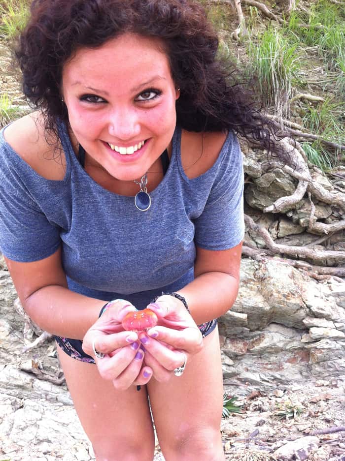 Nadia Jeljeli shows off a find that appears to be a crabshell.