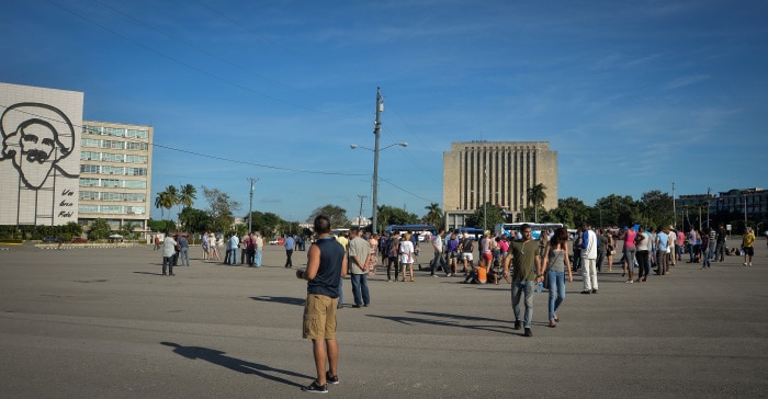 Journalists and dissidents wait for Cuban performance artist Tania Bruguera at Revolution Square in Havana, on Dec. 30, 2014.