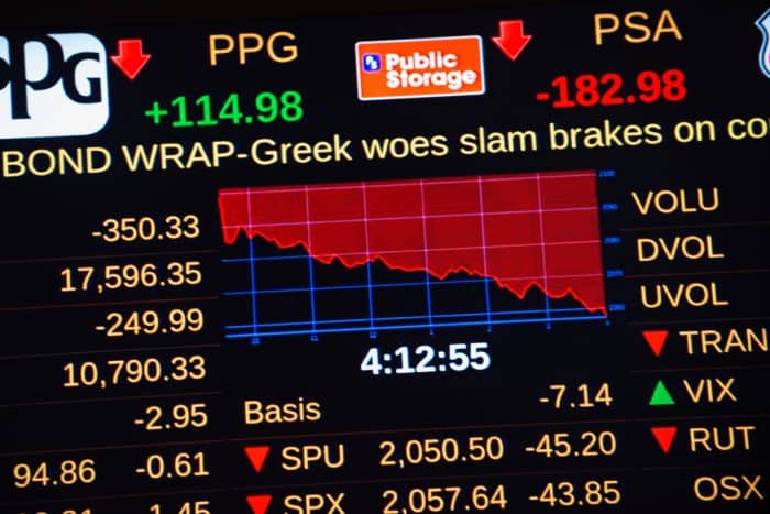 A headline about Greece's debt crisis scrolls across a stock ticker at the New York Stock Exchange.