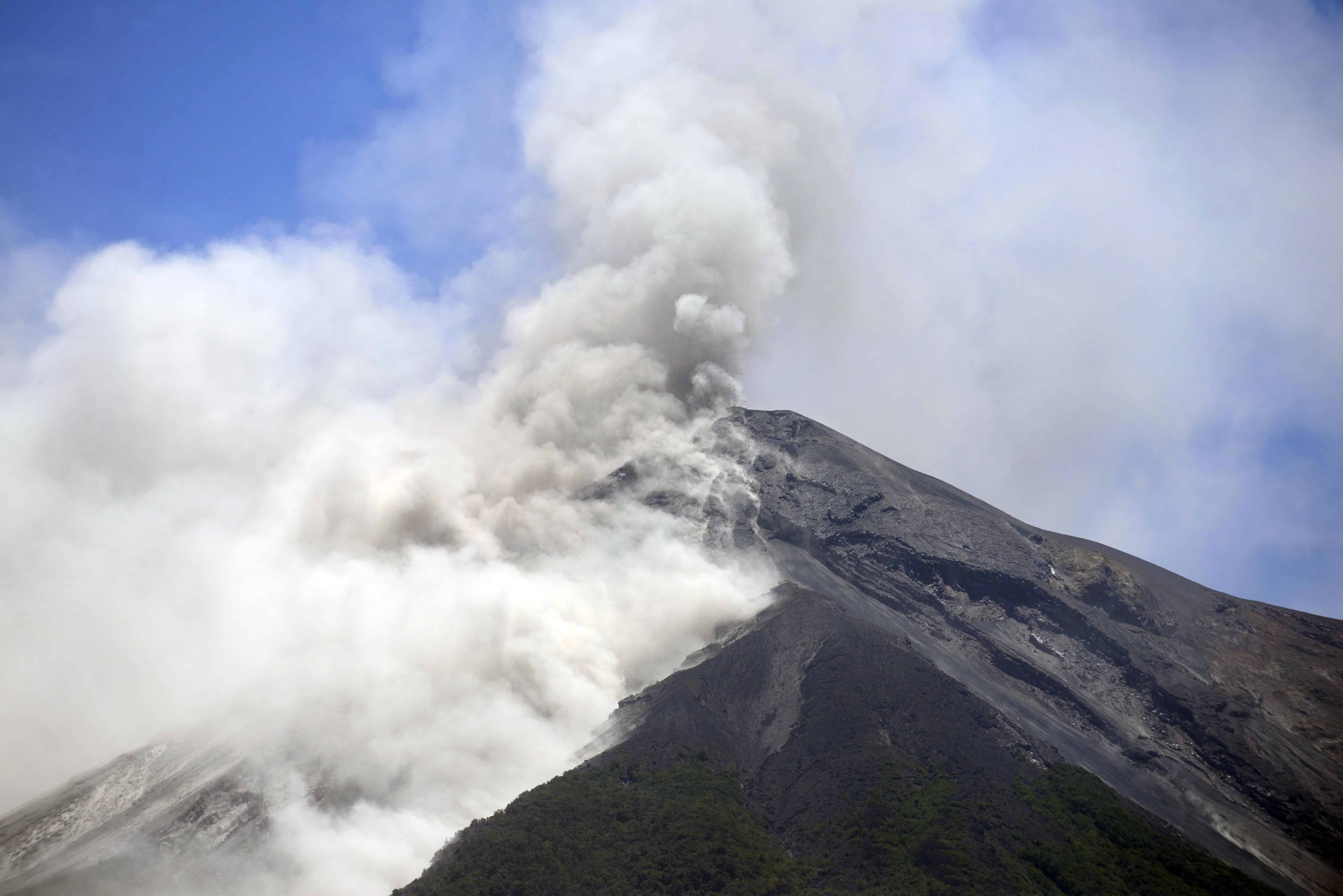 The Fuego Volcano, seen from Alotenango municipality, Sacatepequez departament, about 65 km southwest of Guatemala City, erupts on July 1, 2015. The volcano spewed lava and columns of ash into the air and authorities have raised the alert level in the area to orange.