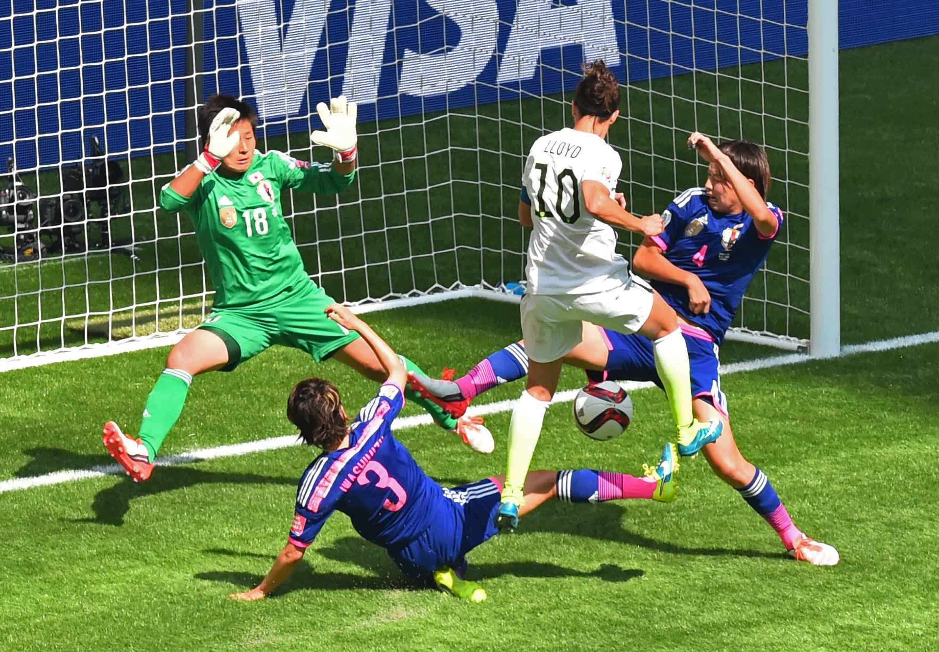 The US's Carli Lloyd (2R) scores a goal against Japan during the 2015 FIFA Women's World Cup final between the USA and Japan at BC Place Stadium in Vancouver, British Columbia on July 5, 2015.