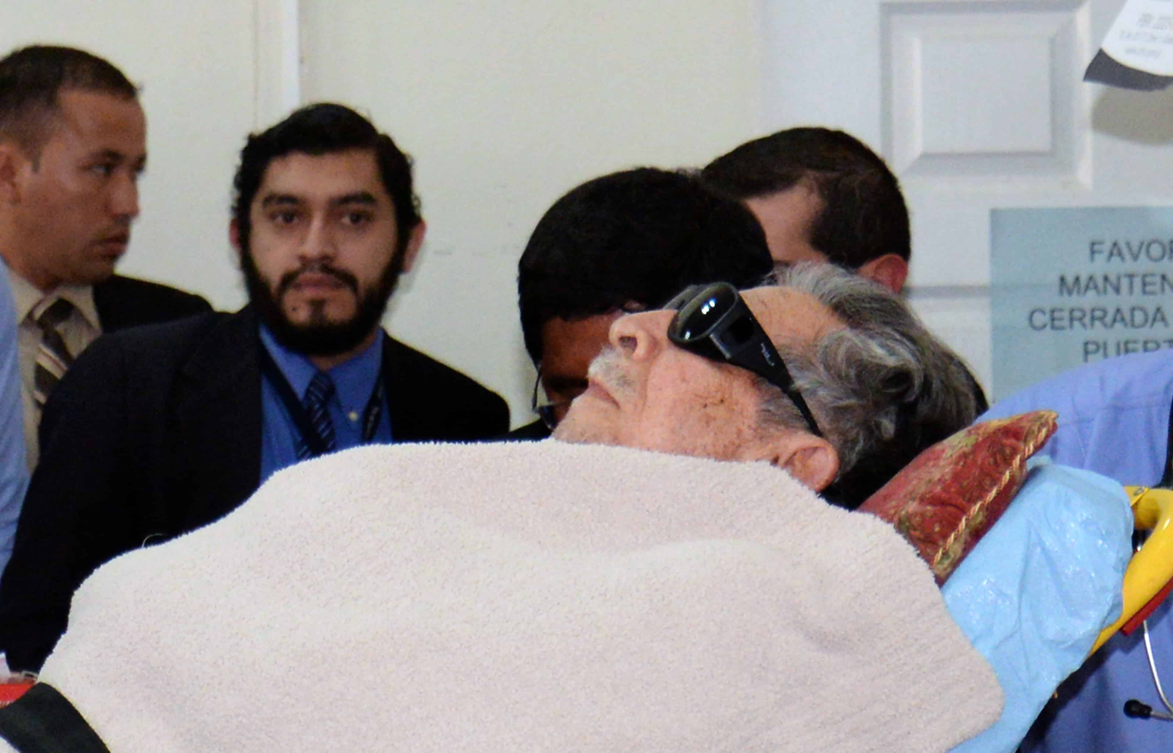 Former Guatemalan de facto president (1982-1983), retired General José Efraín Ríos Montt, arrives on a stretcher as a retrial against him opens in Guatemala City, on January 5, 2015.