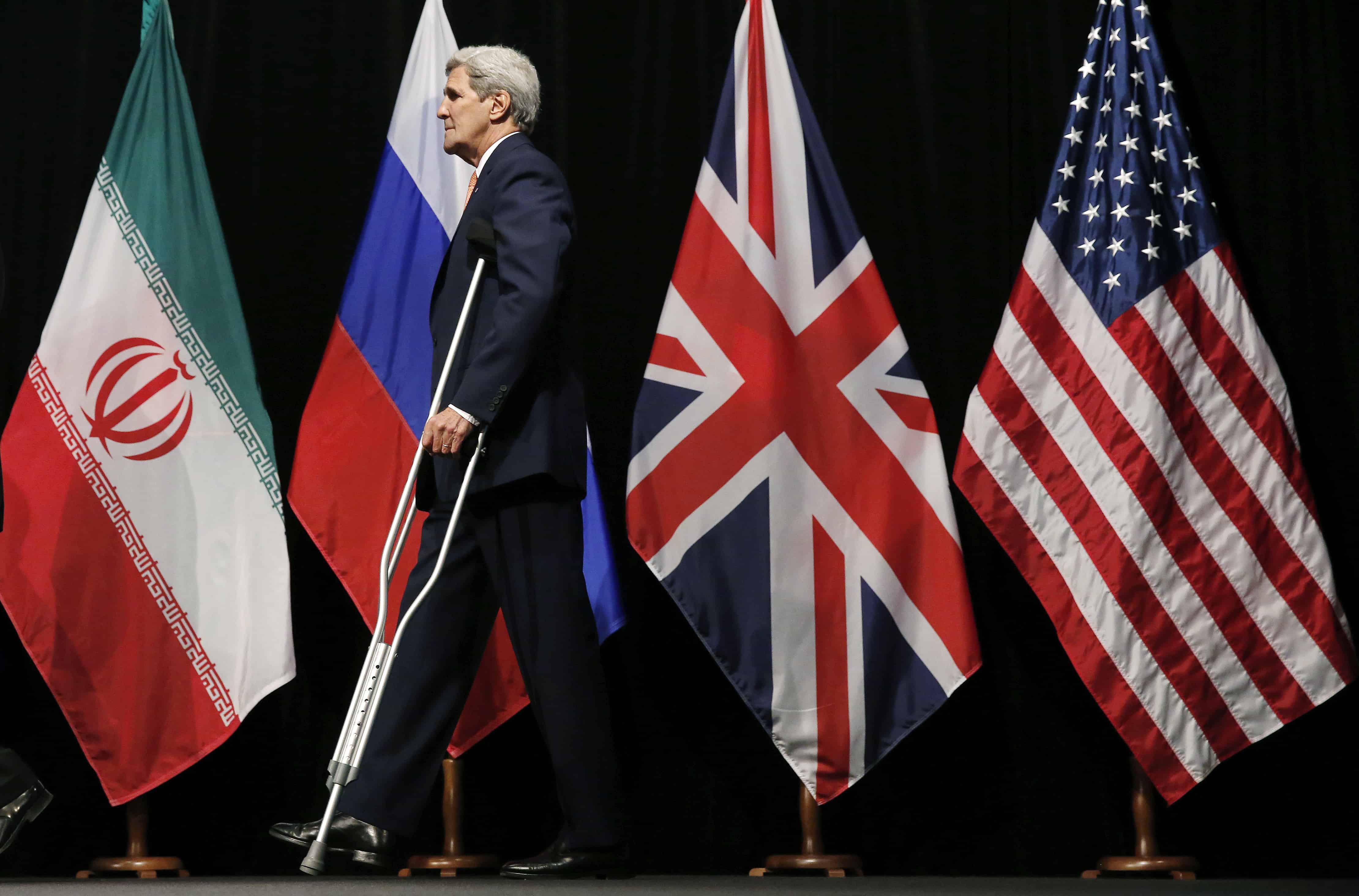 U.S. Secretary of State John Kerry leaves the stage after a group picture with foreign ministers and representatives from China, Iran, Britain, Germany, France, and the European Union at the Vienna International Center in Vienna, Austria July 14, 2015. Iran and six major world powers reached a nuclear deal on Tuesday, capping more than a decade of on-off negotiations with an agreement that could potentially transform the Middle East, and which Israel called an 