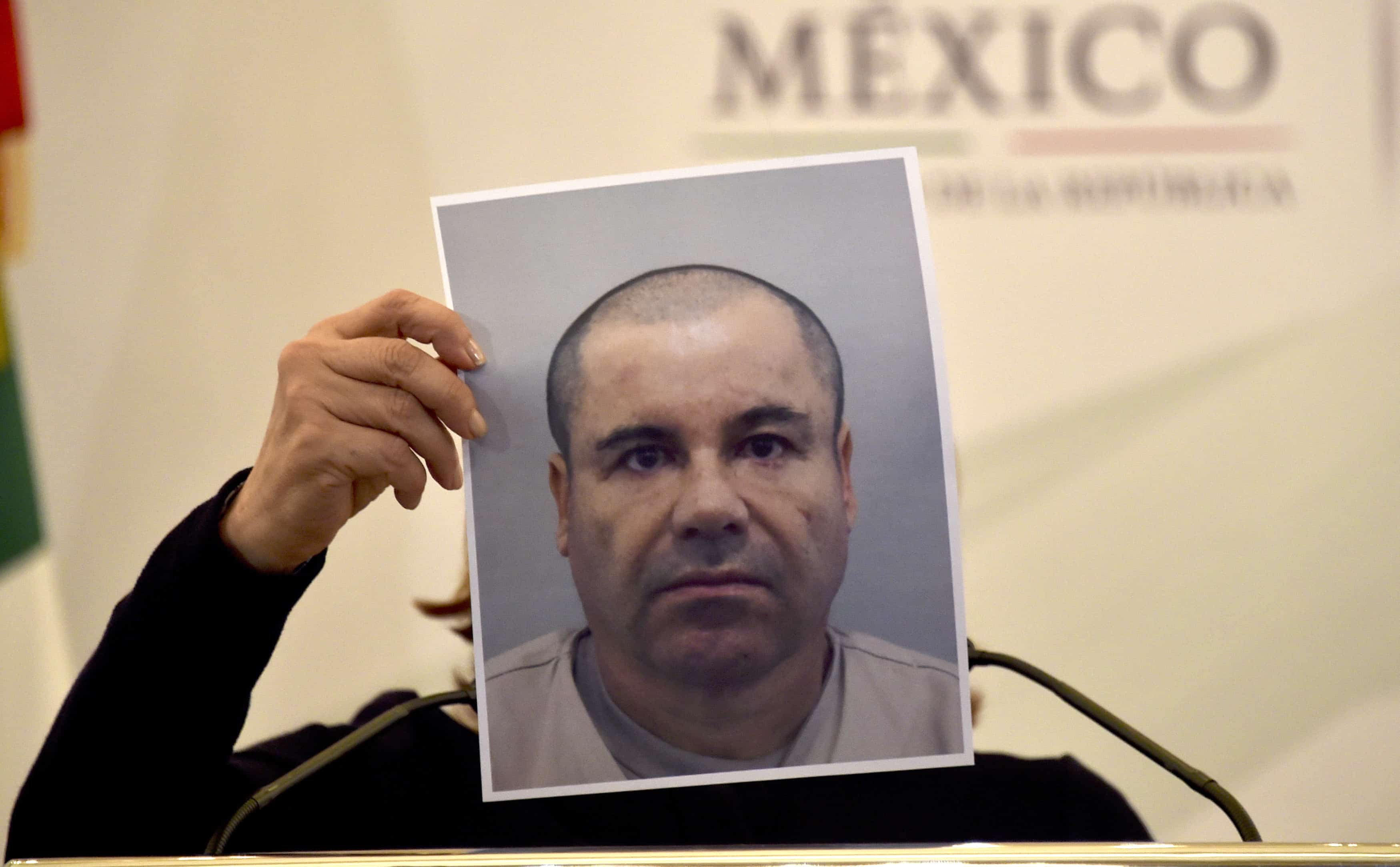 Mexico's Attorney General Arely Gomez shows a picture of Mexican drug kingpin Joaquín 