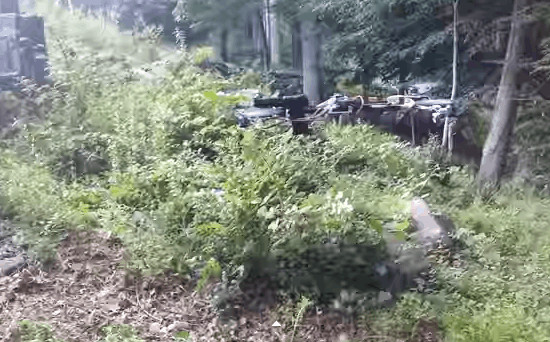 Screenshot of a video showing a handgun firing from its mount on a quadcopter. US authorities say they are investigating, July 21, 2015.
