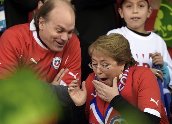 Chilean President Michelle Bachelet, right, attends the 2015 Copa América football championship final .