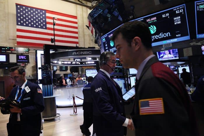 Traders work on the floor of the New York Stock Exchange.