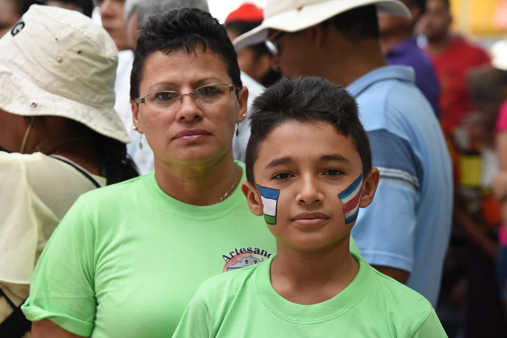 A young Nicoyano proudly wears the Costa Rican and Guanacaste flags.