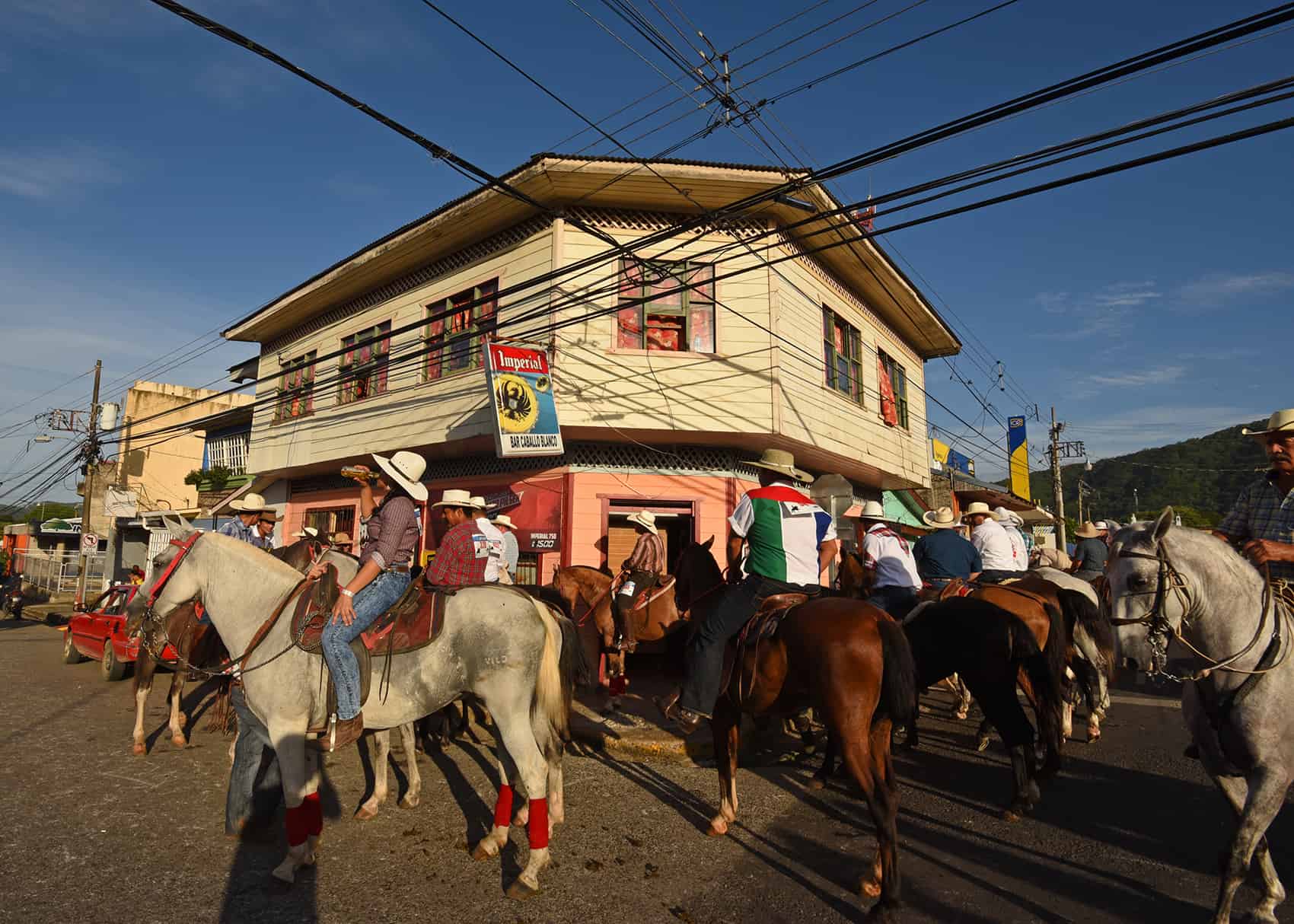 After only traveling five blocks, several riders make a quick stop to quench their thirst, another Guanacaste tradition.