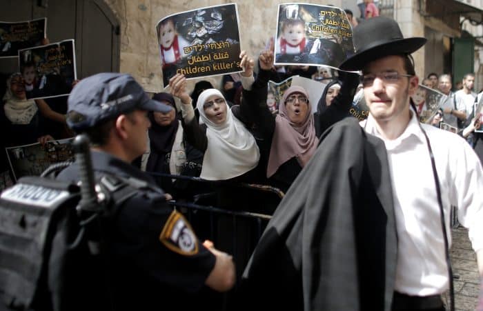 Israeli security forces block Palestinian protesters from using a road leading to the annexed east Jerusalem Al-Aqsa mosque.