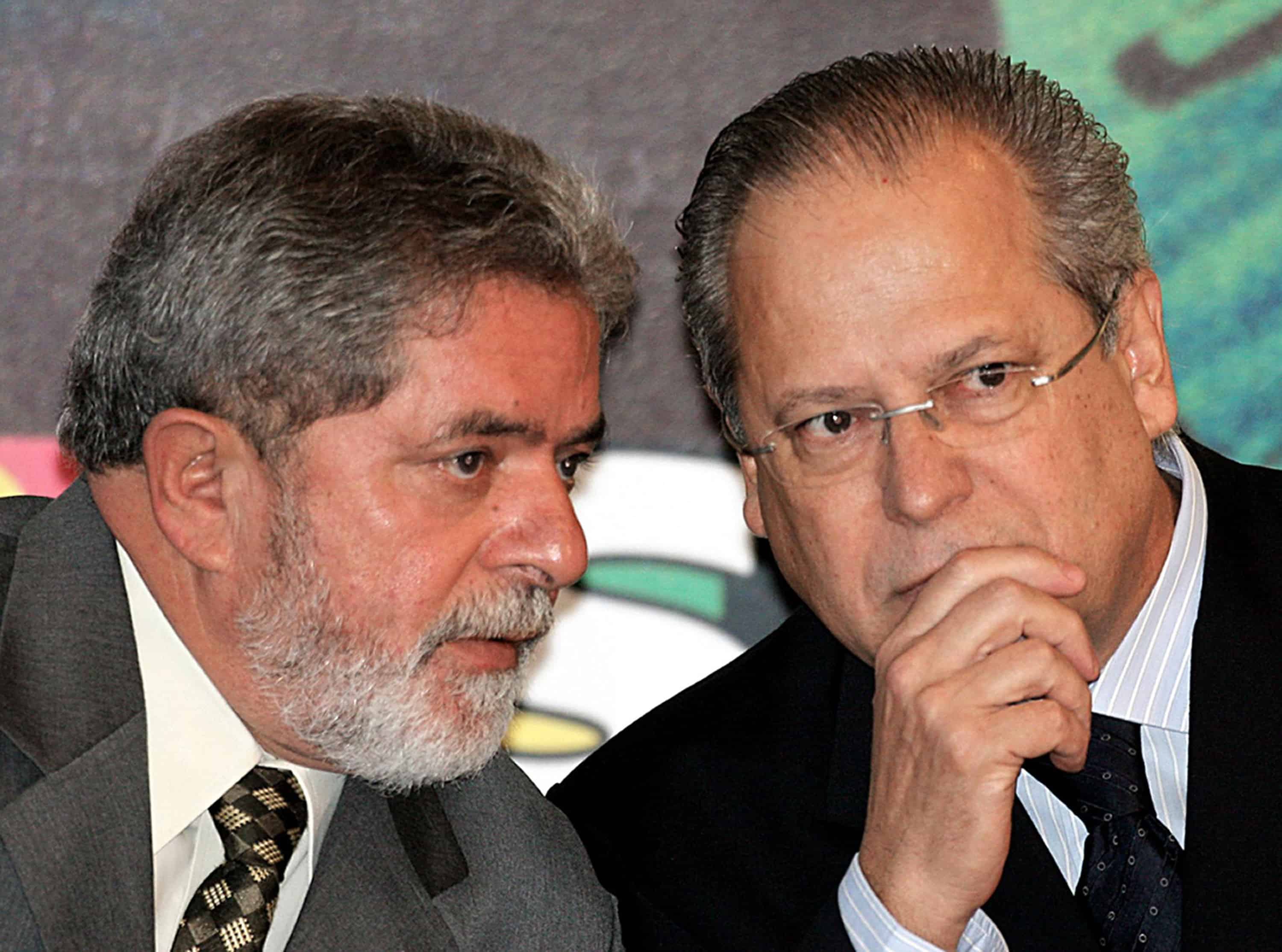 A file photo shows Brazil's ex-President Luiz Inácio Lula da Silva, left, speaking with his then-aide José Dirceu .