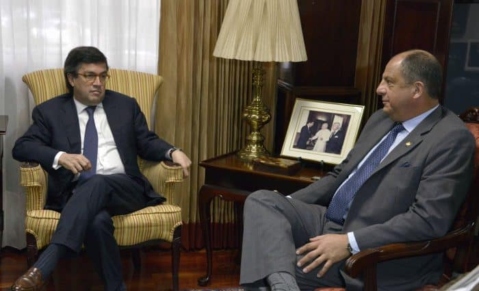 Costa Rican President Luis Guillermo Solís, right, meets with the president of the Inter-American Development Bank, Luis Alberto Moreno.