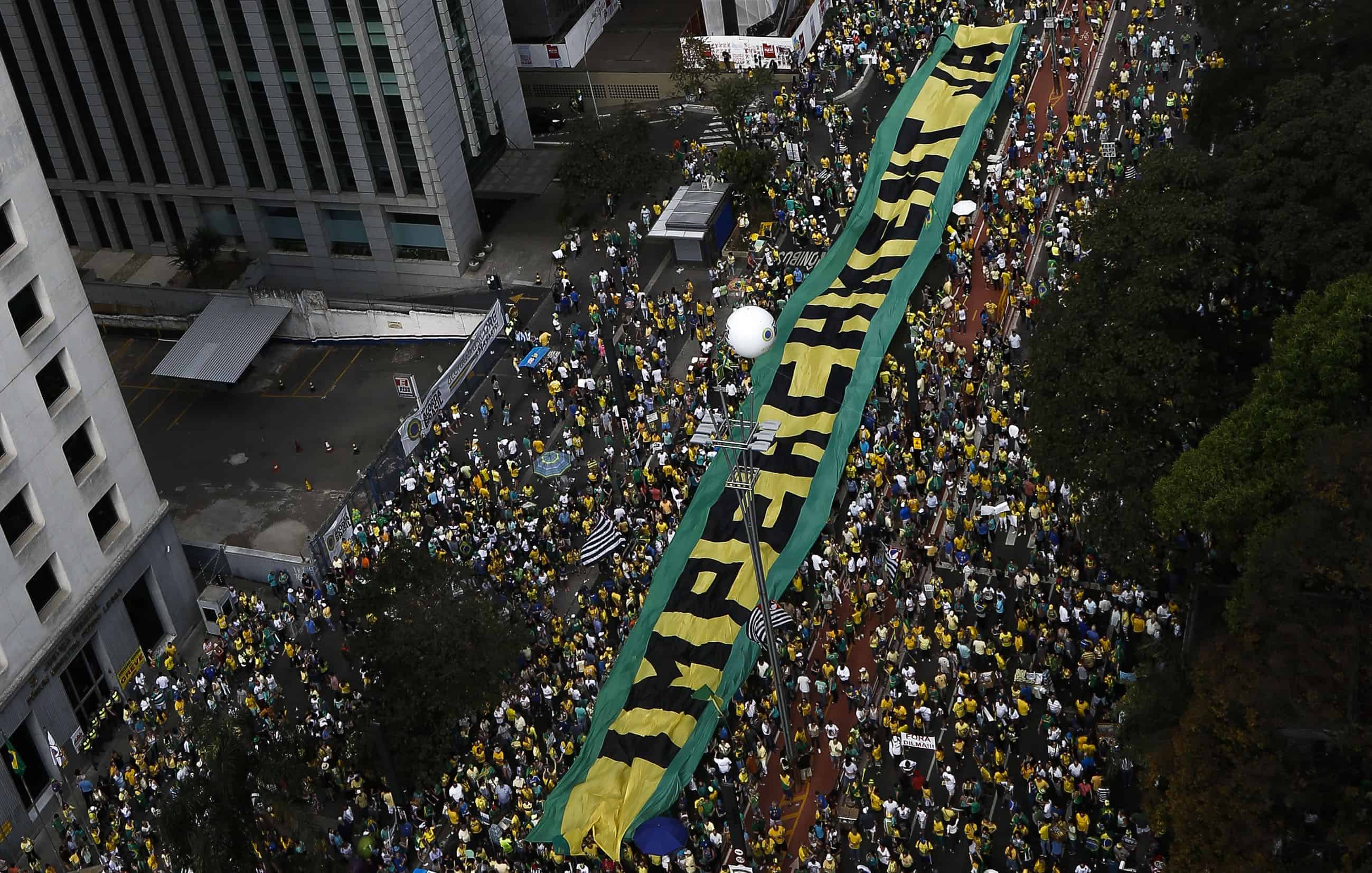 Demonstrators protest against Brazilian President Dilma Rousseff and the ruling Workers Party (PT), at Paulista Avenue in Sao Paulo, Brazil on August 16, 2015.
