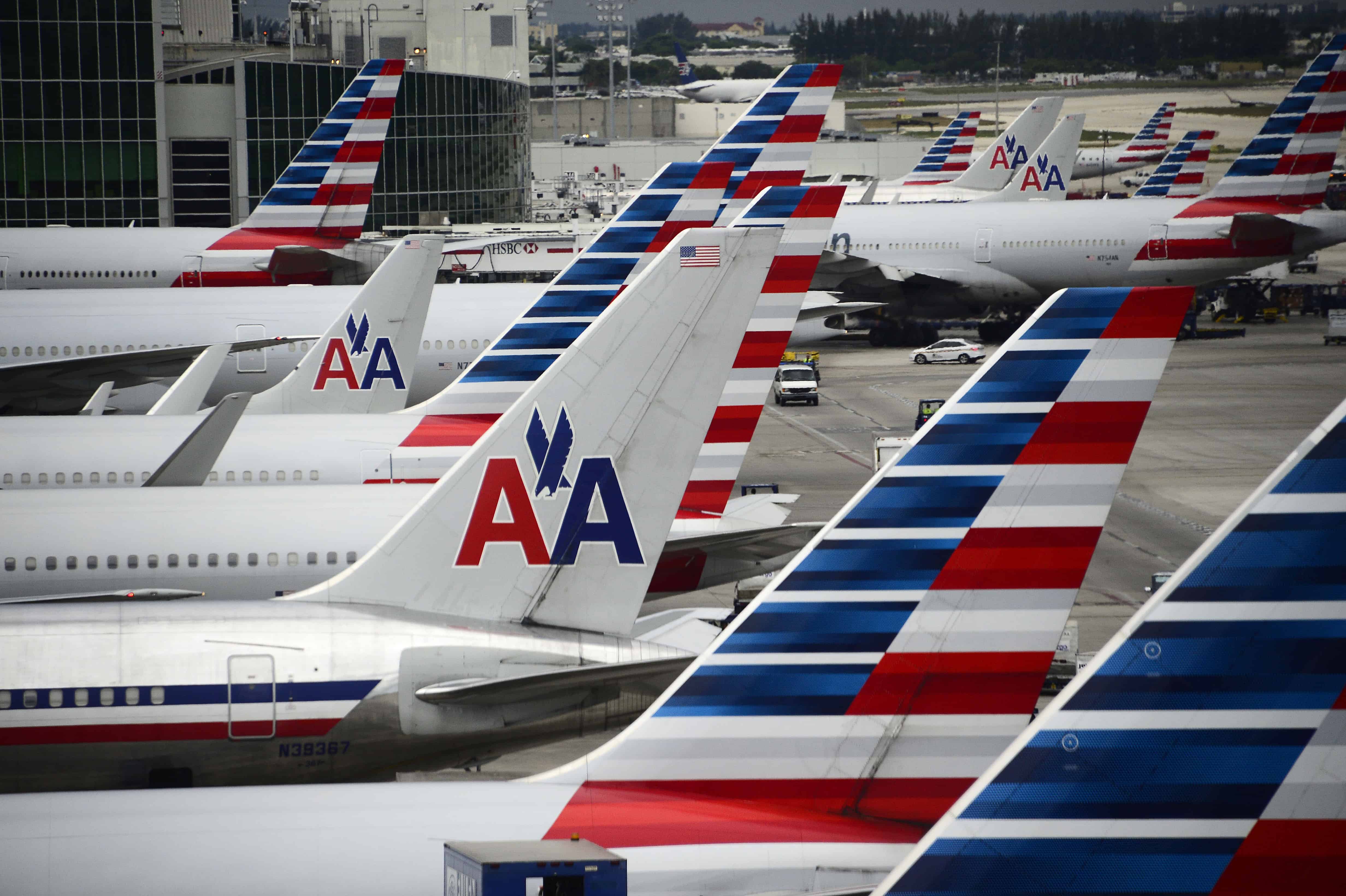 American Airlines planes stand on the tarmac at Miami International Airport.