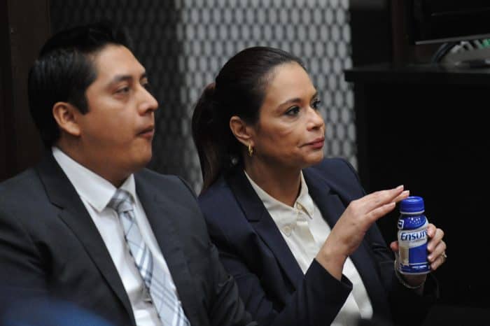 Guatemala's former Vice President Roxana Baldetti, right, sits next to her lawyer Mario Cano during a hearing in court.