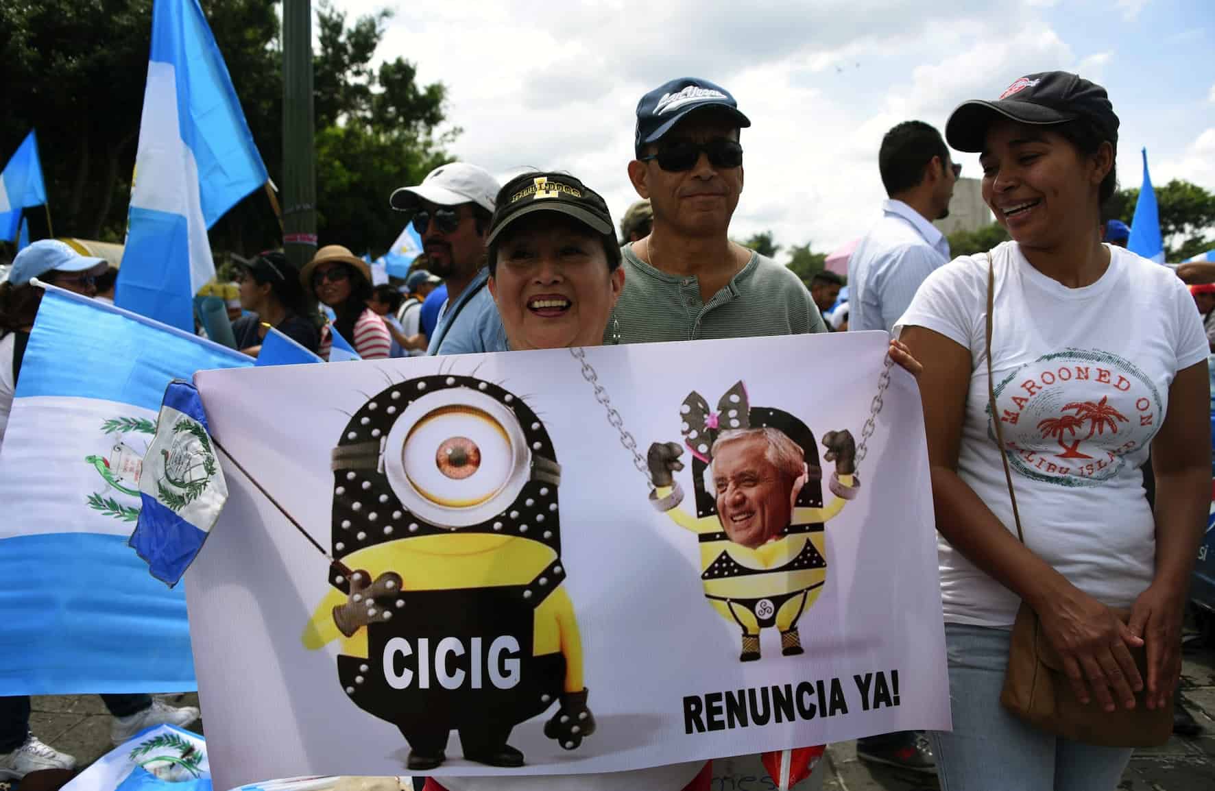 People protest to demand that Guatemalan President Otto Pérez Molina step down over a corruption scandal, in Guatemala City on Aug. 27, 2015.