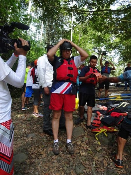 Solís puts on a rafting helmet.