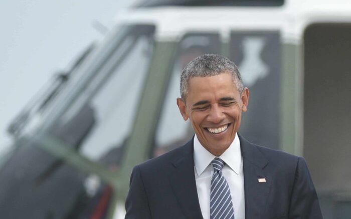 U.S. President Barack Obama walks across the tarmac to board Air Force One.