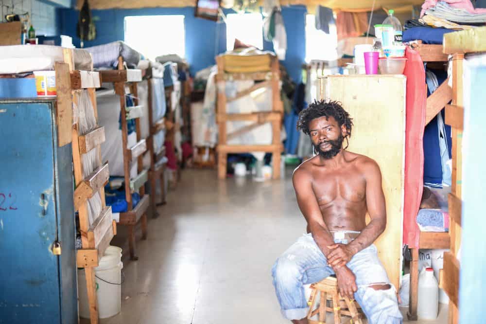 Andrew Thomas watches TV in a room at La Reforma prison. He has spent 21 years locked up for what he calls "big mistakes" and has two more to go.