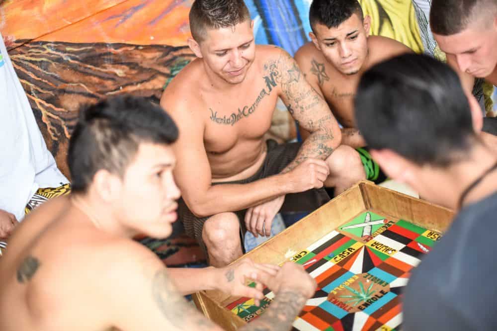 Prisoners play a board game at La Reforma prison.