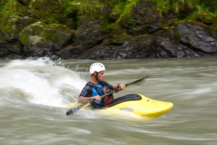 Kayakers often accompany rafting groups to help in case of trouble, but they spend much of their time honing their kayak rodeo skills.