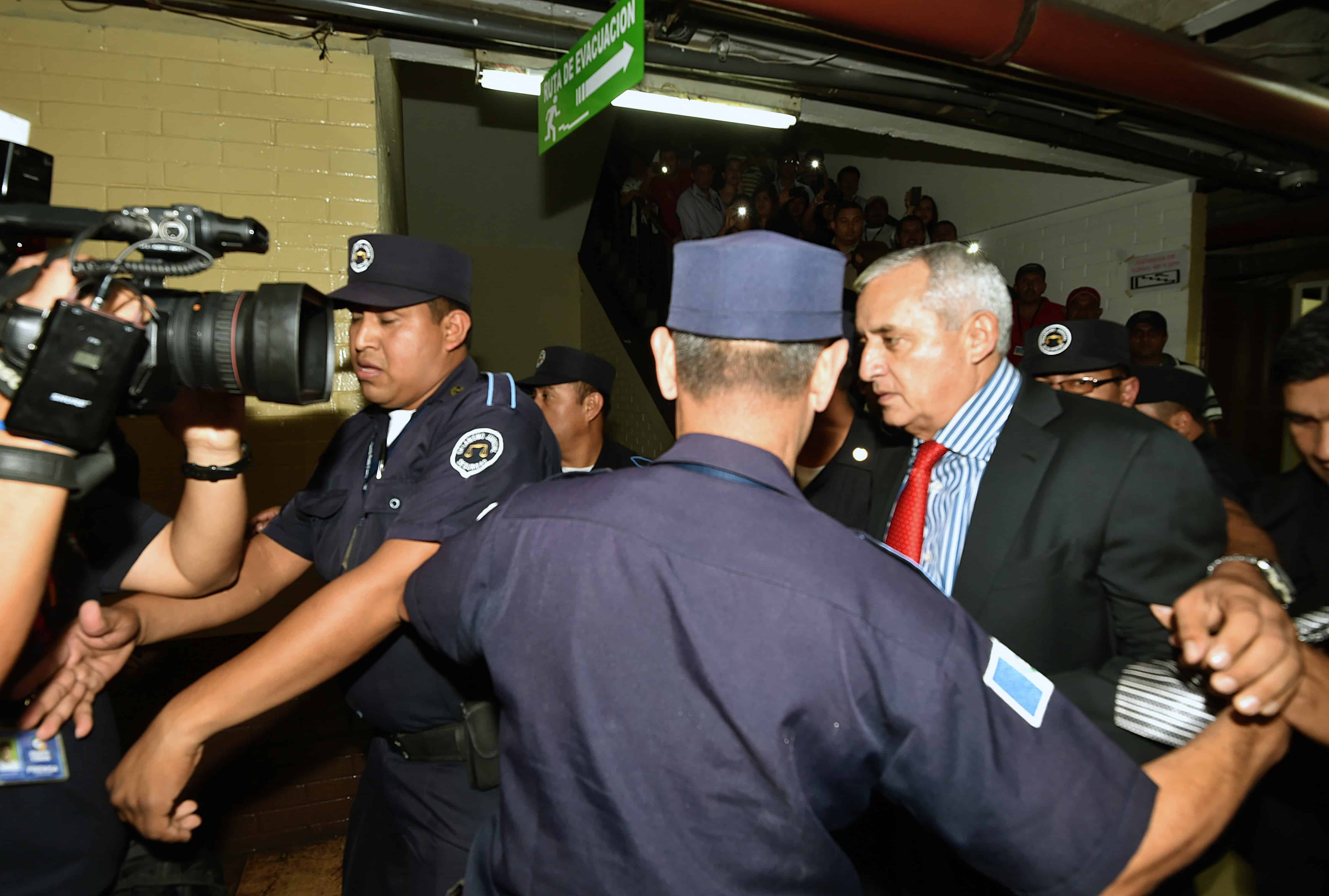 Guatemala's former President Otto Pérez Molina, right, arrives at the Tribunal of Justice in Guatemala City, on Sept. 3, 2015.