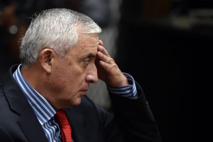 Guatemalan ex-President Otto Pérez Molina gestures during a hearing at the Tribunal of Justice in Guatemala City, on Sept. 3, 2015.