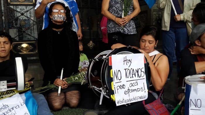 Guatemalan protesters dress in black on Saturday, Sept. 5 to "mourn" the country's general elections on Sunday, which many believe were tainted by ongoing corruption scandals.