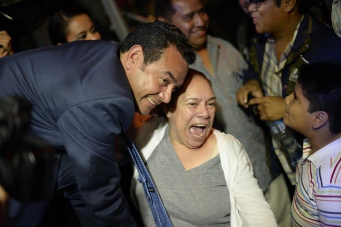 Presidential frontrunner Jimmy Morales celebrates with supporters after preliminary results for the general elections are released, at party headquarters in Guatemala City, early on Sept. 7, 2015