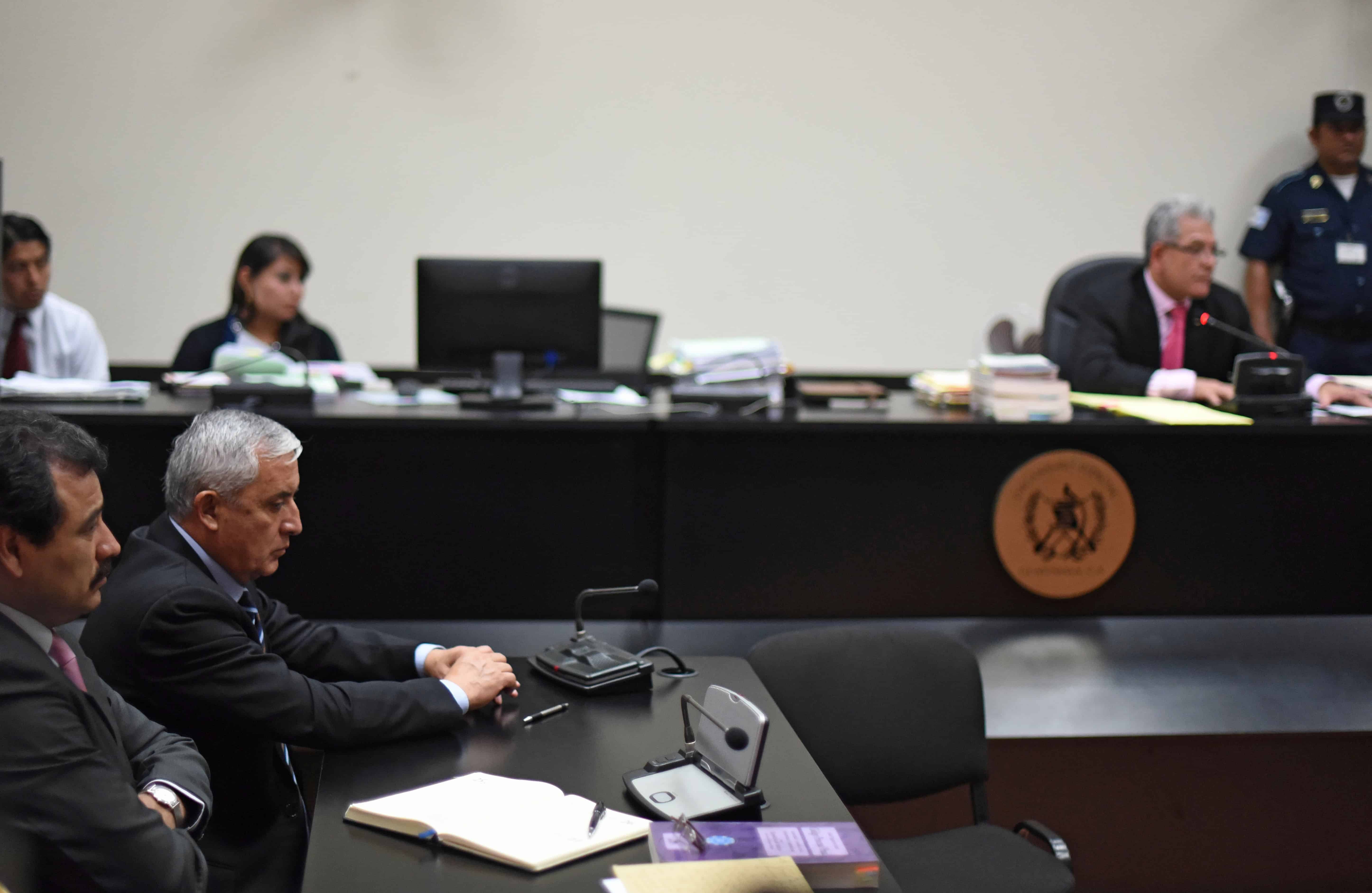 Guatemalan ex-President Otto Pérez Molina, second left, is indicted on corruption charges in a court in Guatemala City, on Sept. 8, 2015.