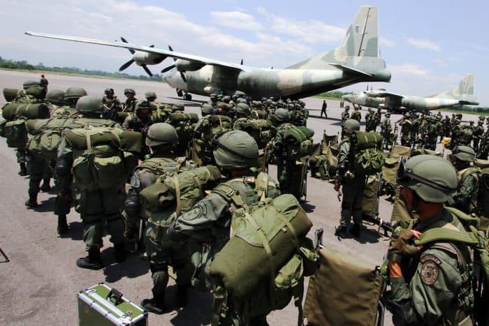Venezuelan Marines deplane from a Venezuelan Air Force (Chinese-made) Y-8F-100 transport aircraft in La Fria, Tachira state, Venezuela, close to the Venezuela-Colombia border on Aug. 31, 2015. 