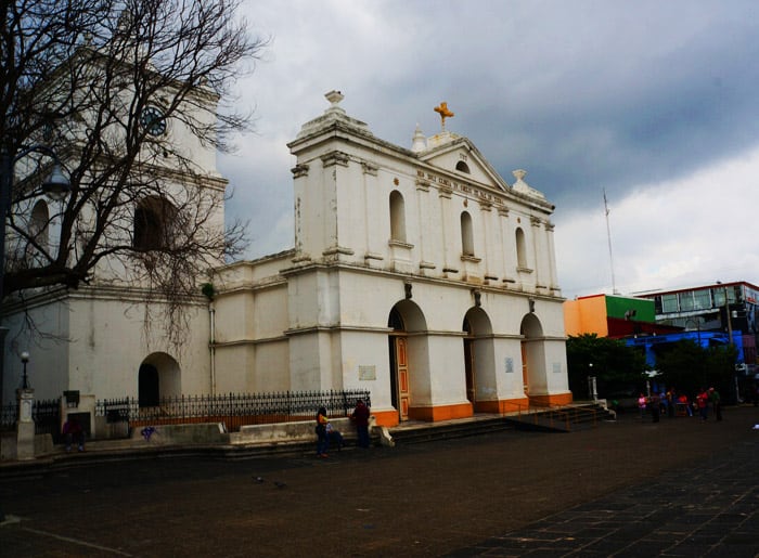 Central Park is bordered by the looming facade of Iglesia Inmaculada Concepción.