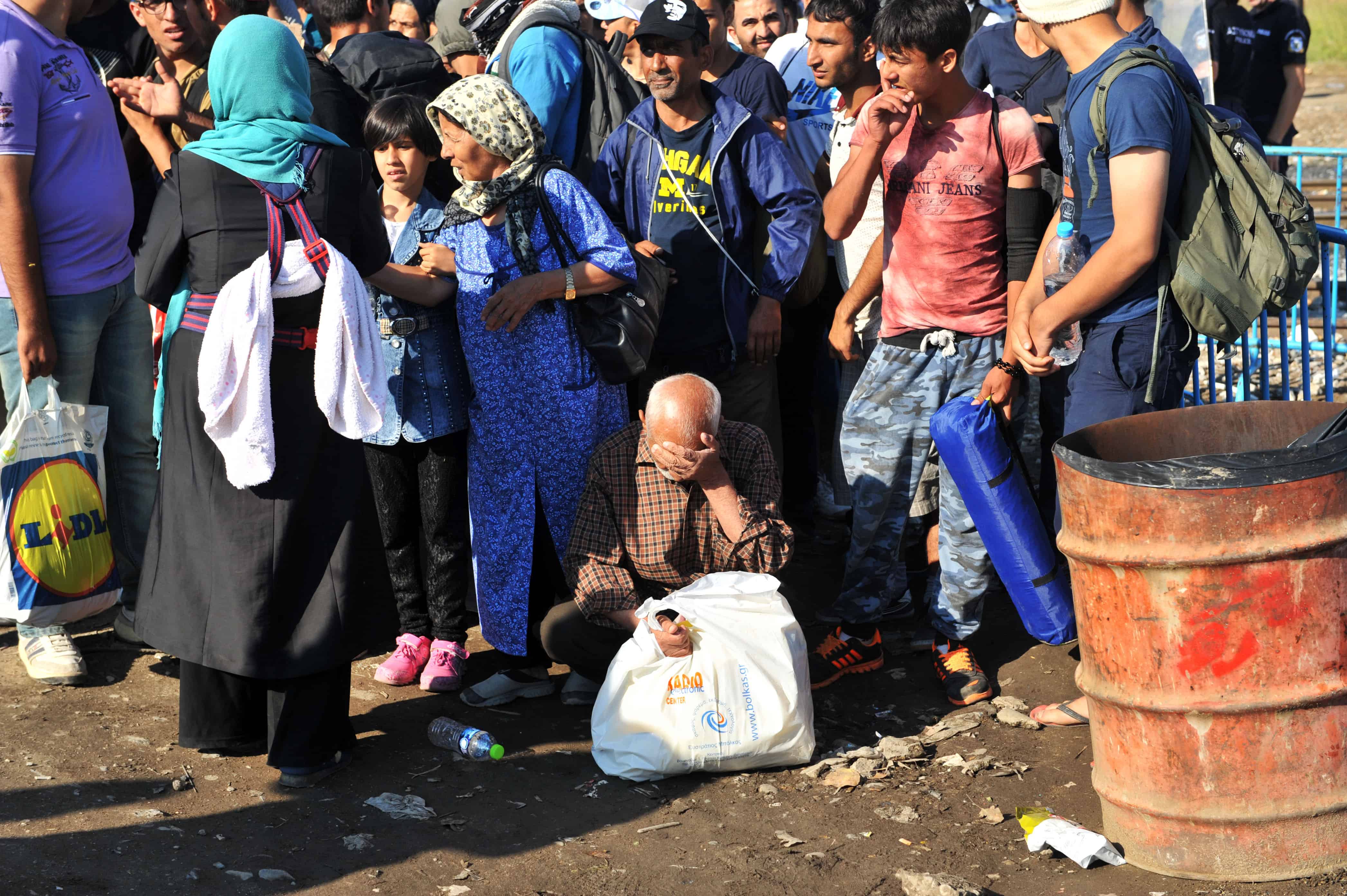Refugees wait to cross the Greece-Macedonia border.