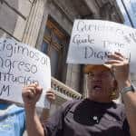 "We want #105. Guate has dignity." They got 105, and then some, as 132 lawmakers voted to strip Pérez Molina of his immunity, in Guatemala City, Sept. 1, 2015.