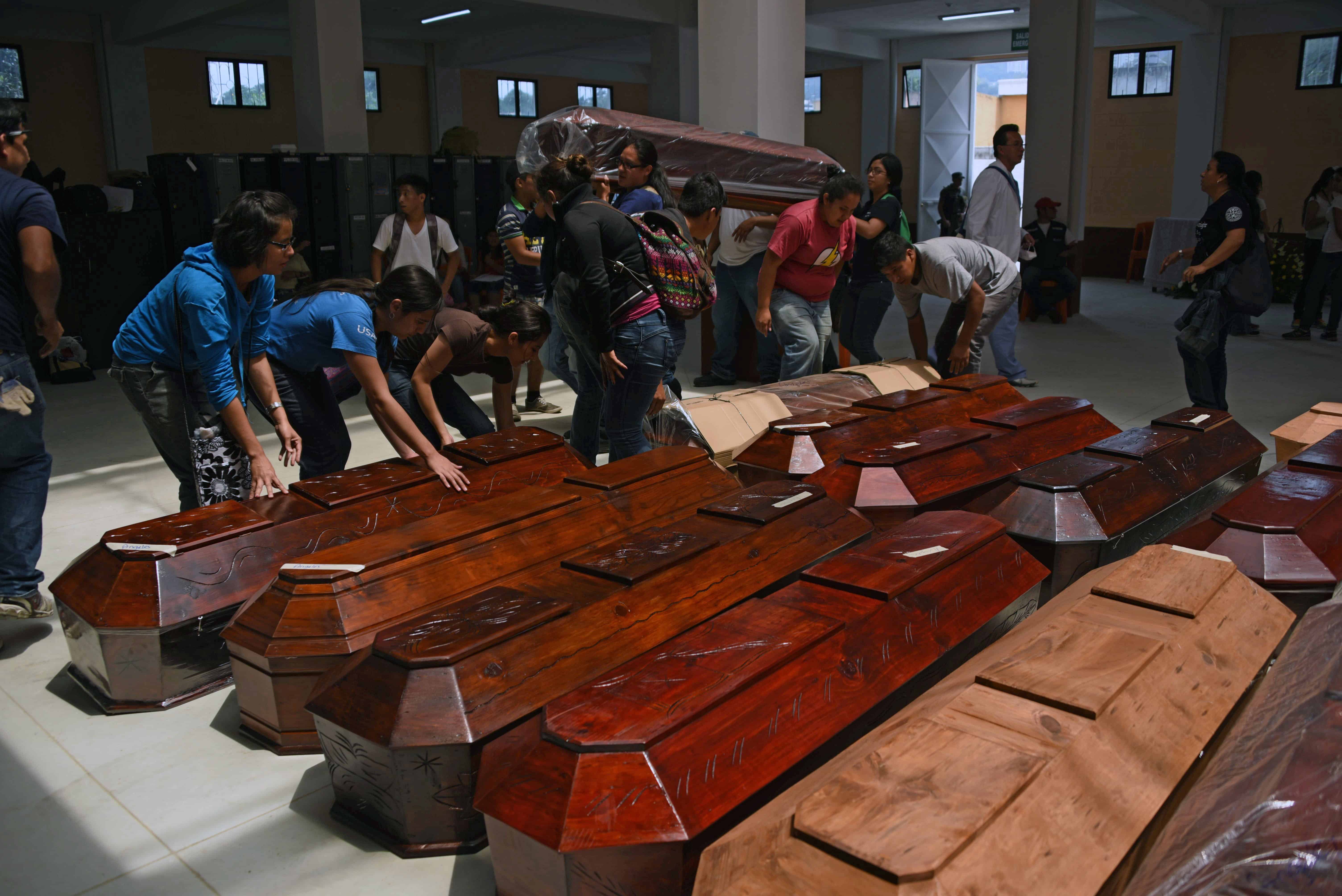 Guatemala landslide coffins.