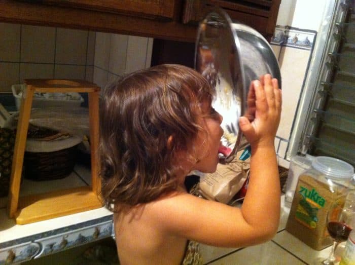 girl licking a bowl