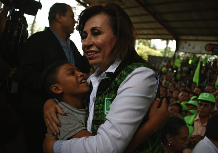 Sandra Torres hugging boy