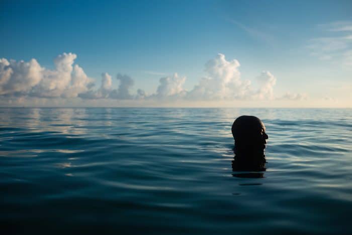 man in water at Punta Frances National Park