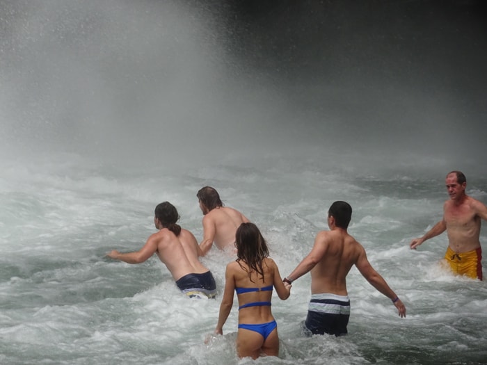 From left: Orpheus, Aladdin, girl in blue bikini, boyfriend of girl in blue bikini and travel writer stagger toward the base of La Fortuna Waterfall.