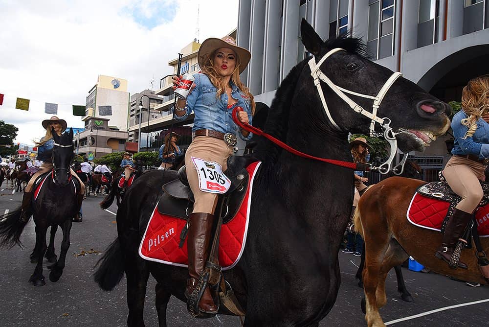 Horse riders parading along San José's Second Avenue during Costa Rica's annual tope.