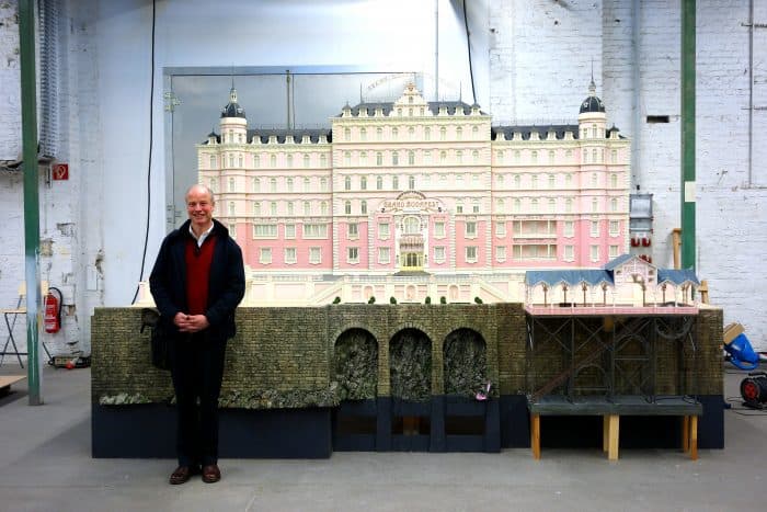 Carl Sprague along with his Grand Budapest Hotel design. [Courtesy of FID]
