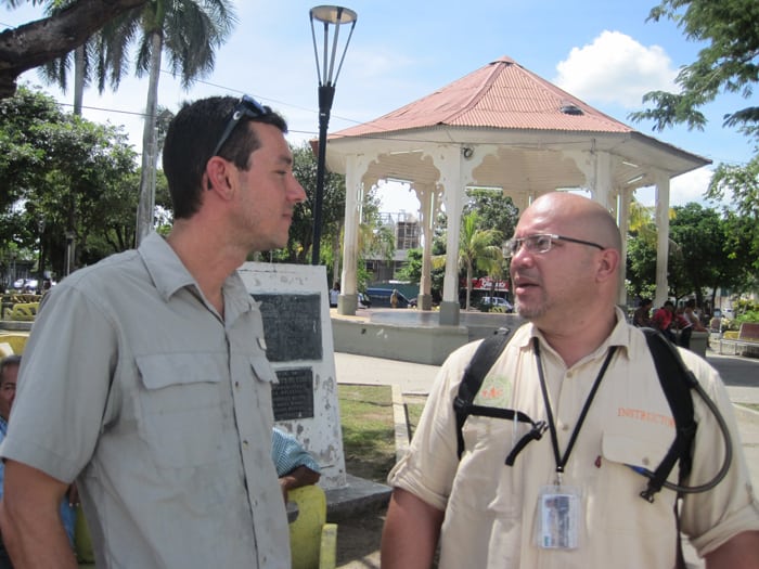 Tour guide Erick Weissel and Tourism Professor Josué Duarte Montes in front of the Gazebo in the Parque Central.