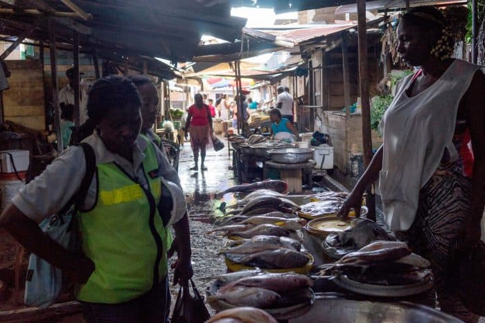 A port worker shops at a fish market in Buenaventura, Colombia.