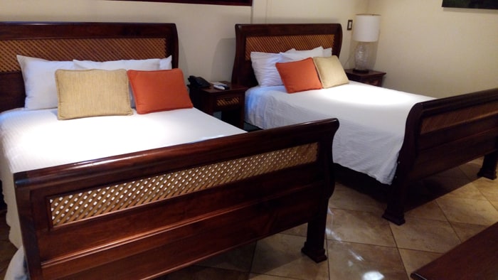 Beds at Bosque del Mar, with the lattice woodwork theme used throughout the hotel.