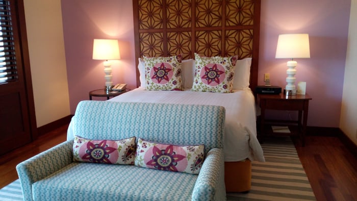 A recent remodeling introduced lots of bright colors in bedrooms that match the flowers outside the windows.