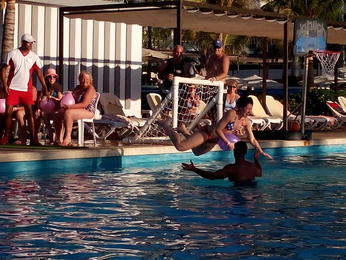 A lively contest where revelers try to pop a balloon with a belly-flop in the pool.