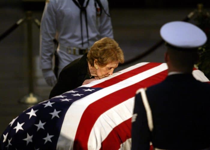 Nancy Reagan kissing Ronald Reagan's casket