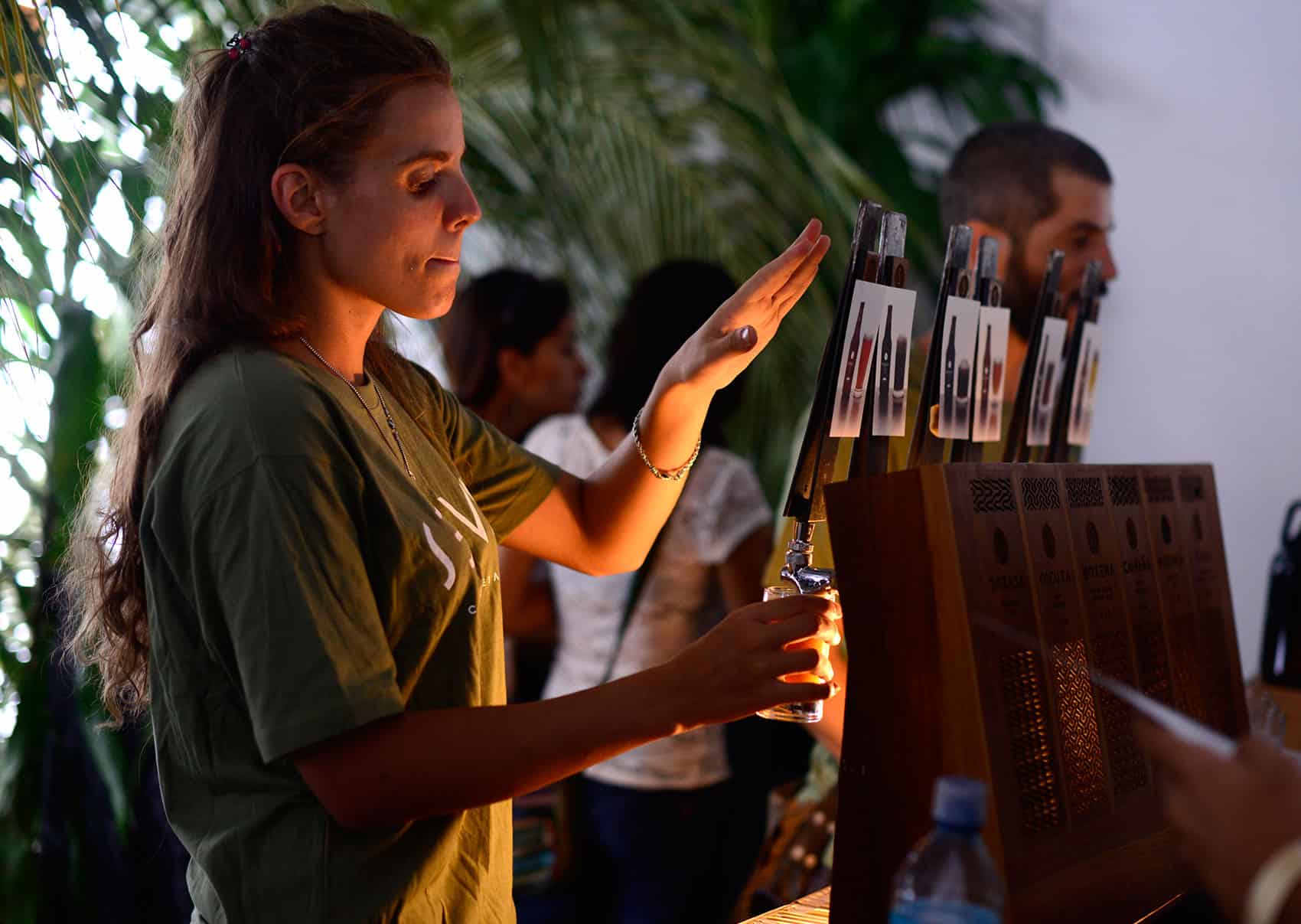 Costa Rica Craft Beer Festival: A bartender pours beer at Selva brewing company