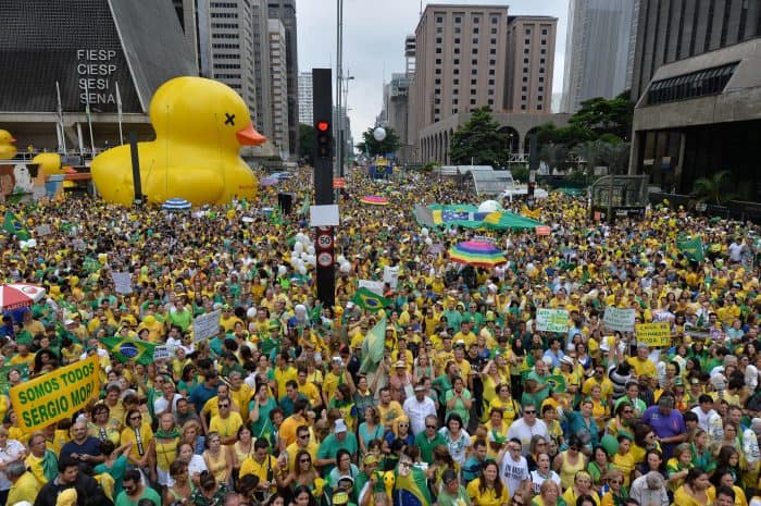 Thousands of Brazilians angered by a massive corruption scandal and a crumbling economy flooded the streets of São Paulo Sunday to call for the removal of President Dilma Rousseff.