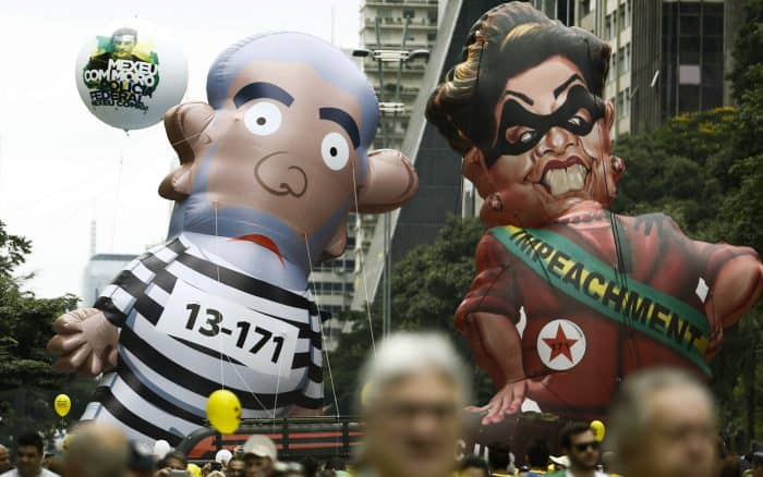 Protesters in Brazil hold giant dolls of Lula and Dilma Rousseff